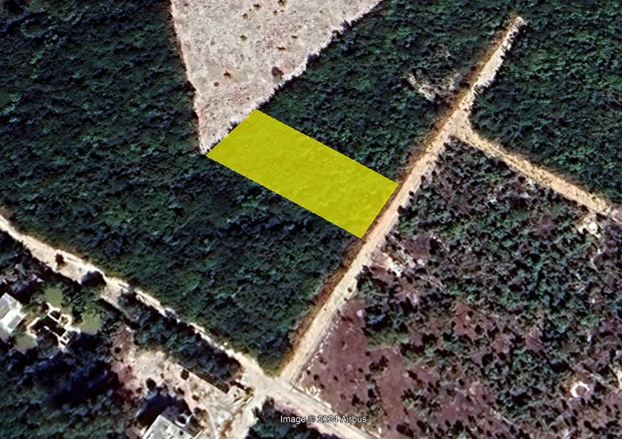 Imagen satelital del terreno habitacional en venta en Isla Blanca, Quintana Roo, ubicado entre la laguna Chacmuchuch y el mar Caribe