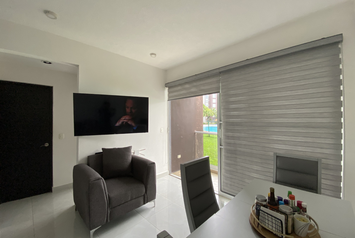 Área social de un departamento en planta baja en Dream Lagoons Cancún