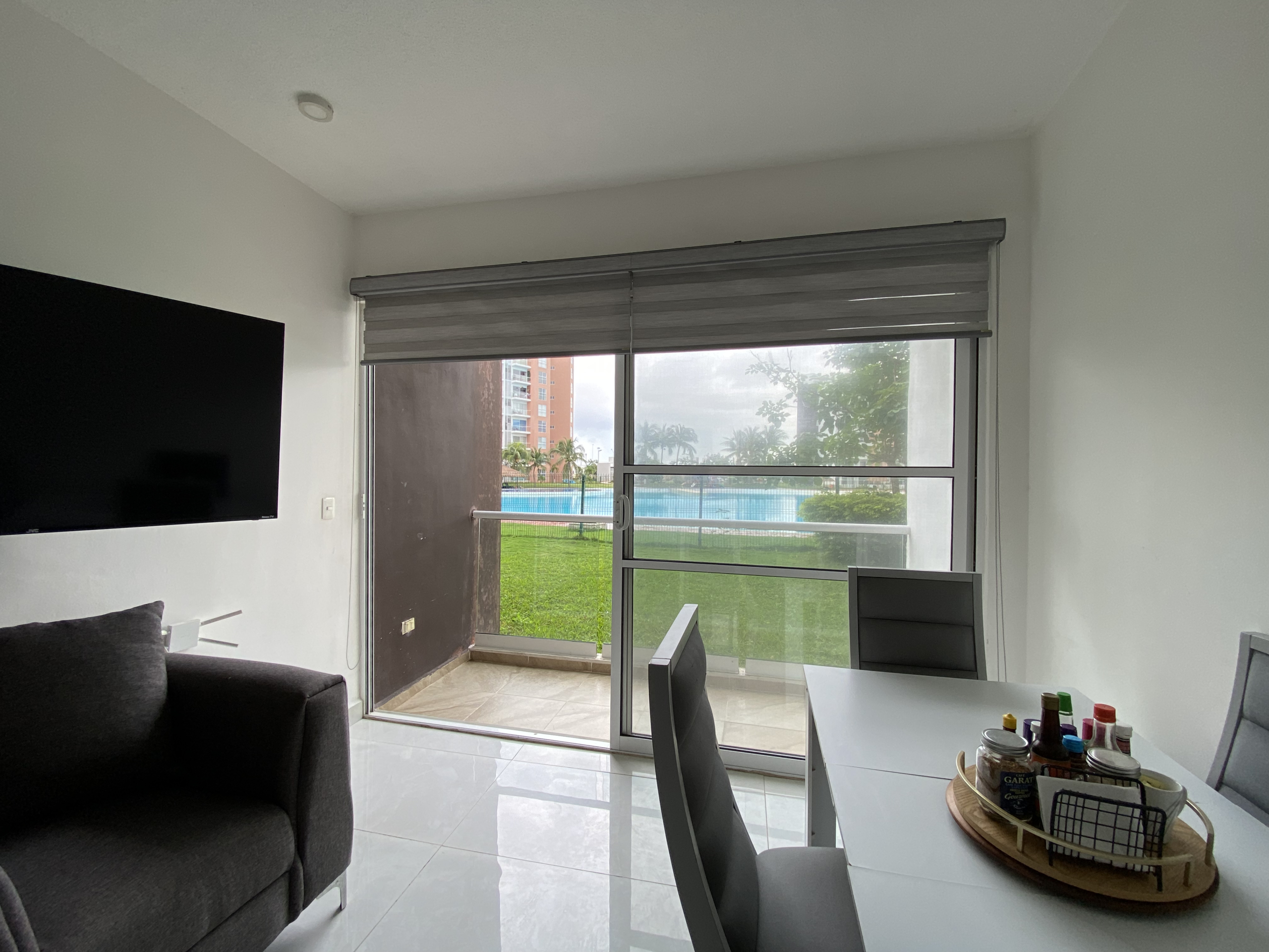 Sala del departamento planta baja en venta en Dream Lagoons Cancún