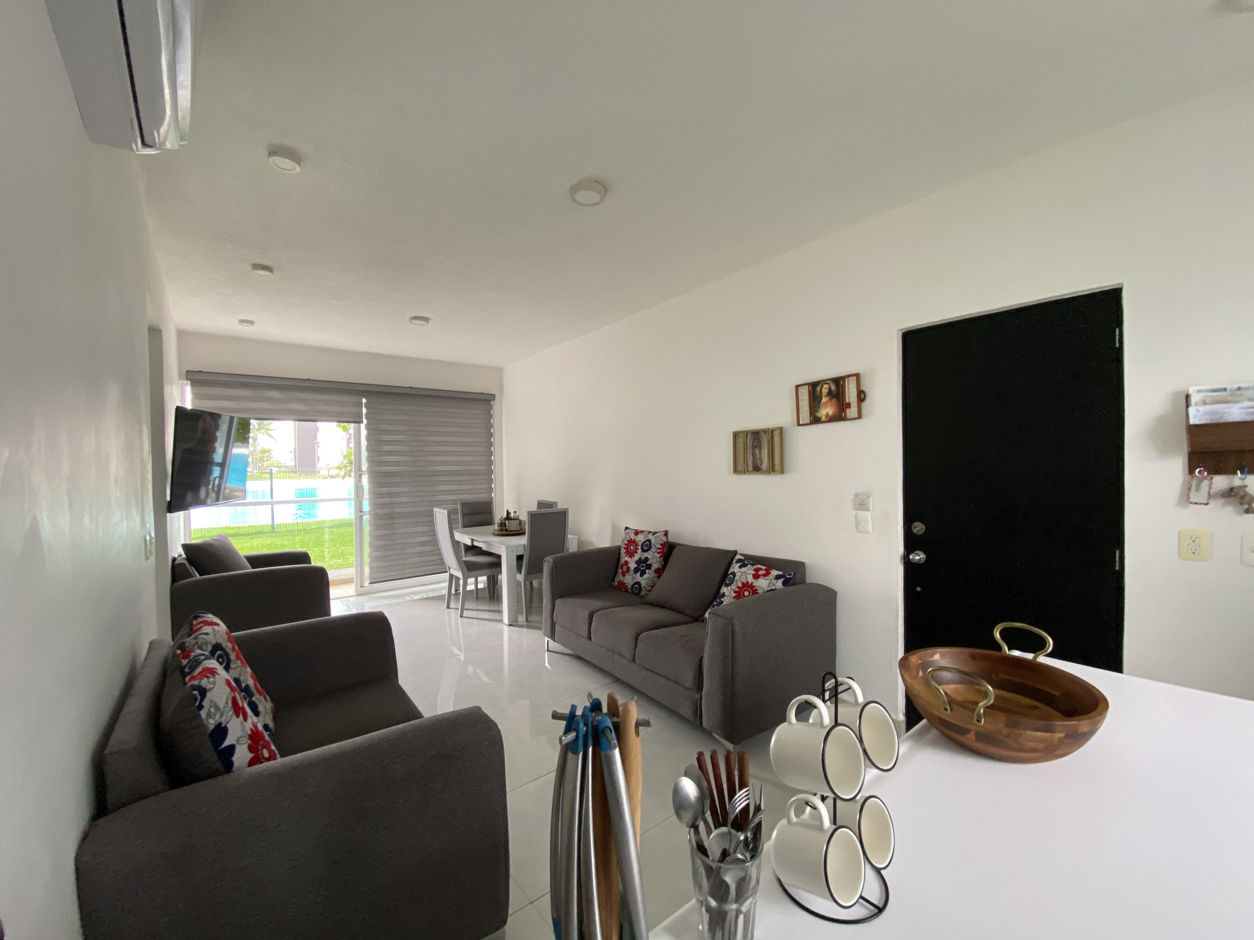 Comedor y Sala del departamento planta baja en venta en Dream Lagoons Cancún